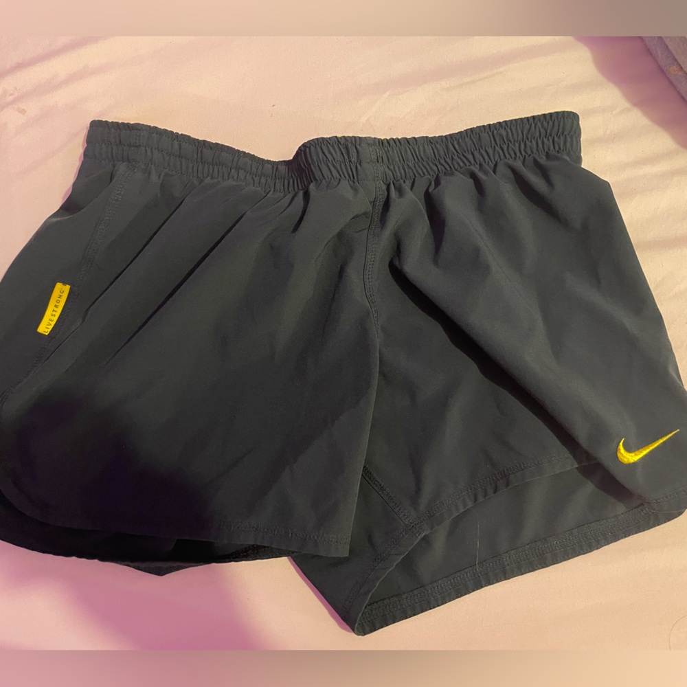 nike black and yellow running shorts